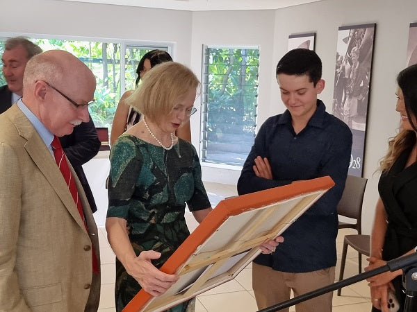 Jesse gifts one of his signature Medicine Leaves paintings